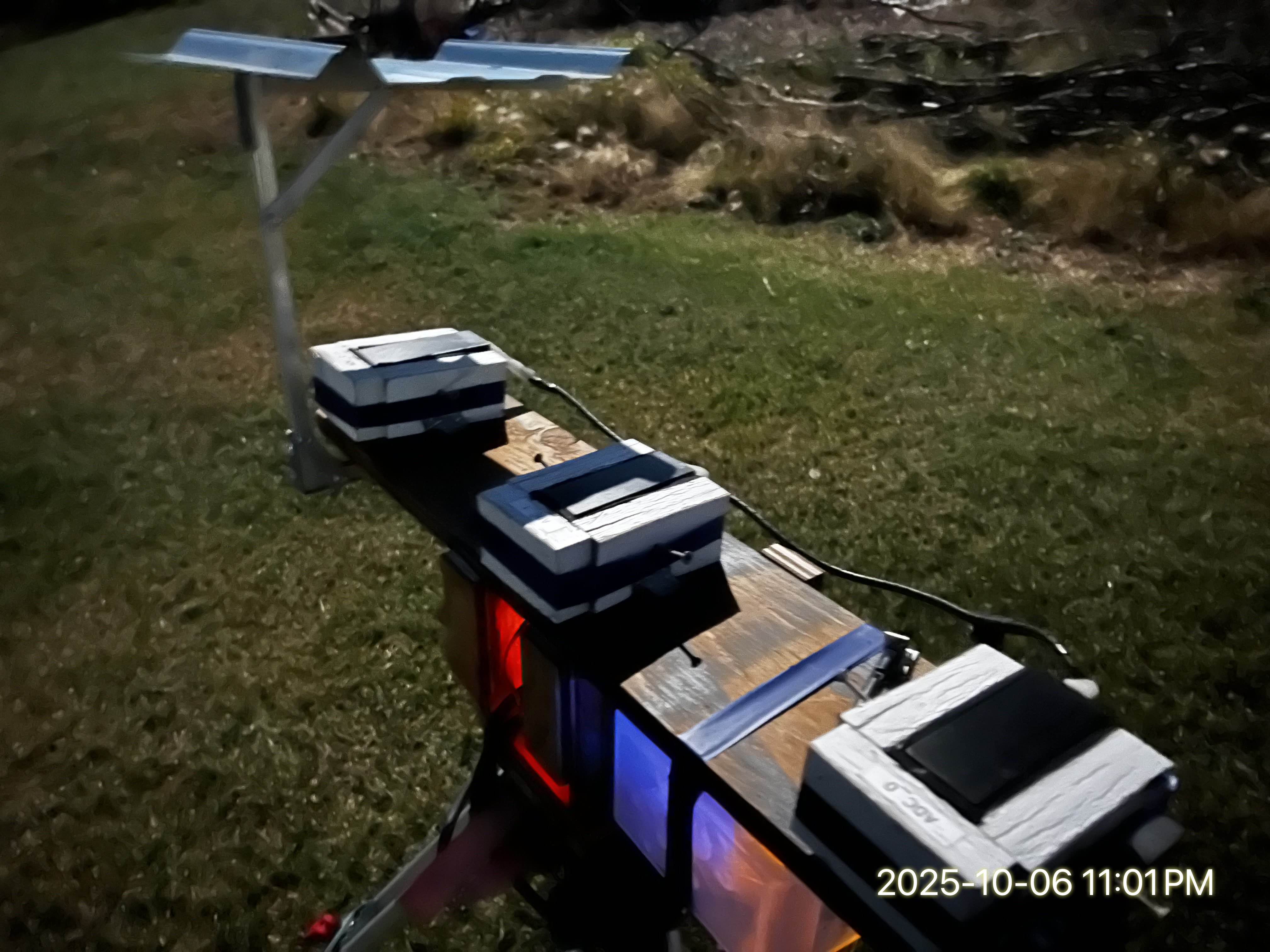 Sensor rig during a moon event — full view showing all three sensor enclosures and metal shadow shield